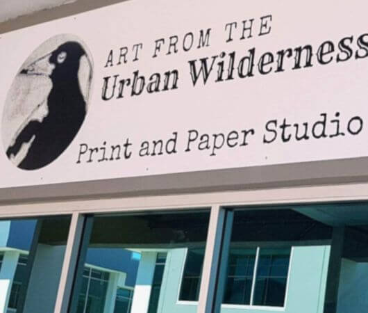 Art from the Urban Wilderness outdoor sign over windows